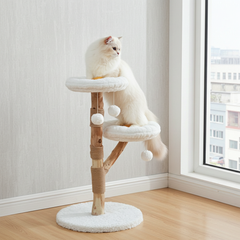 White cat stretching between two flower-shaped cat tree perches
