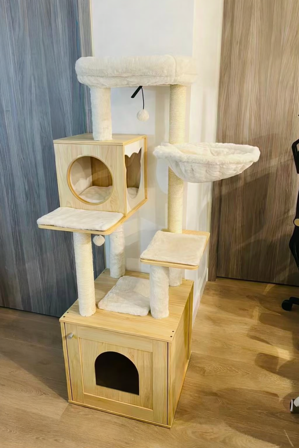Cream wooden cat tree with condo, hammock and cushioned platforms