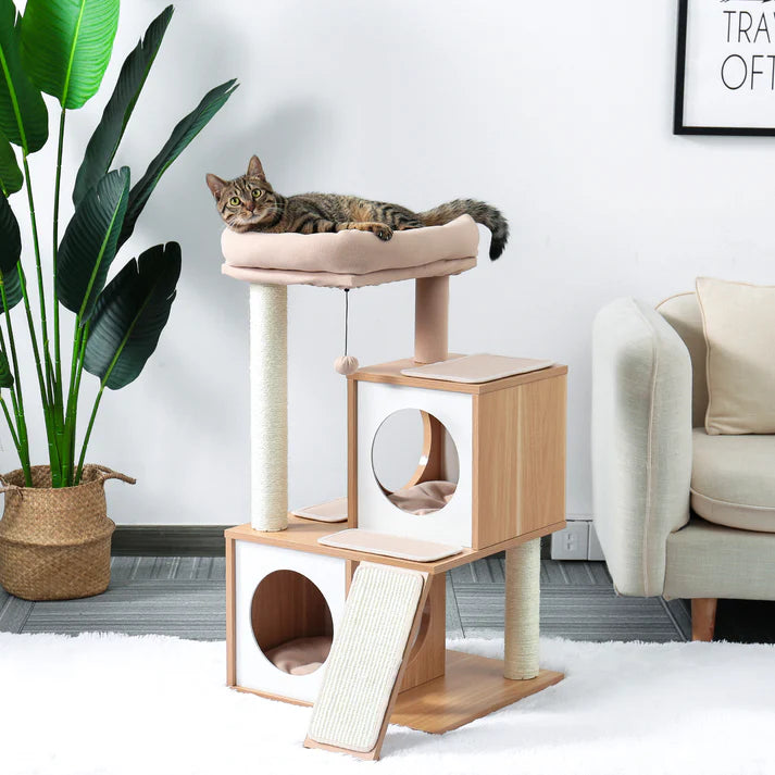 Cat resting on the top bed of a wooden cat tree in a living room