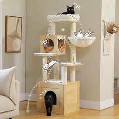 Cats using the perches, hammock and condos of a cream wooden cat tree