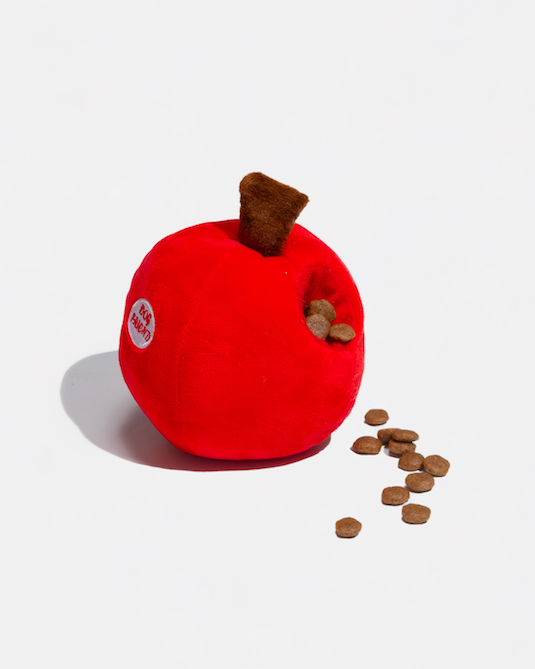 Red apple plush toy with treats in its hiding pocket
