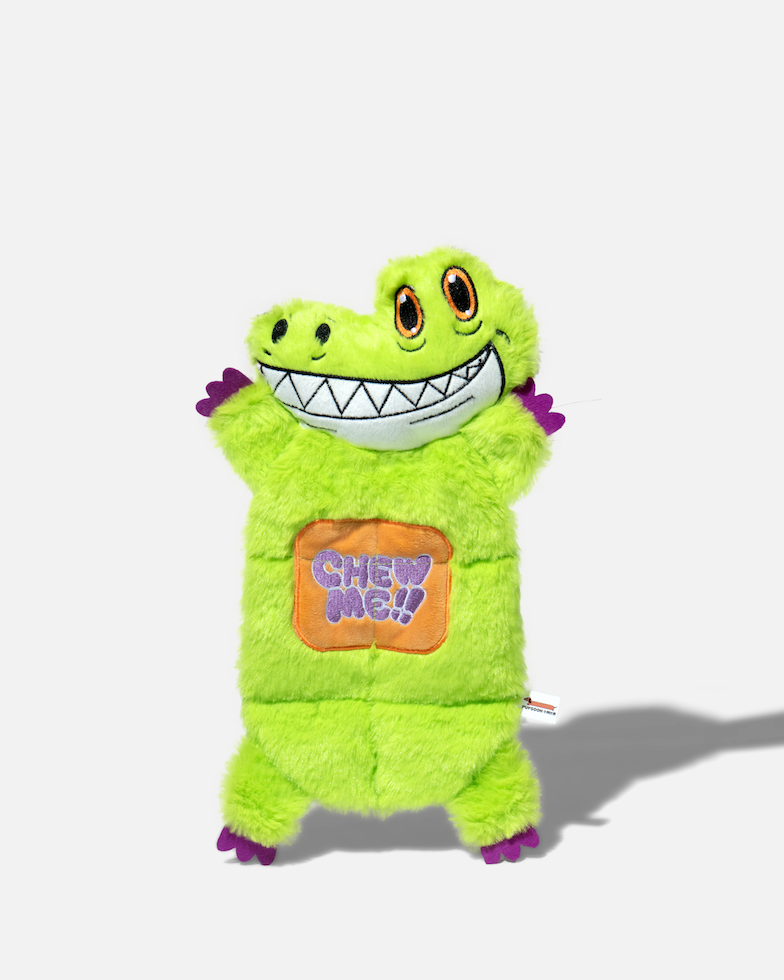 Front view of a green crocodile plush dog toy