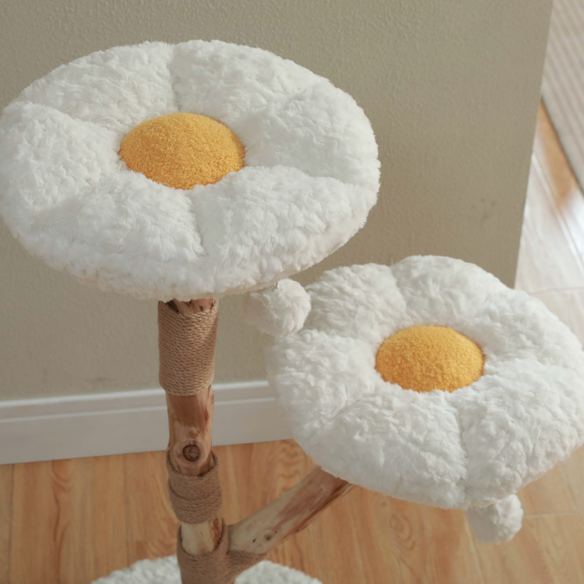 Close-up of two plush flower-shaped cat tree perches