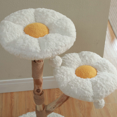 Close-up of two plush flower-shaped cat tree perches
