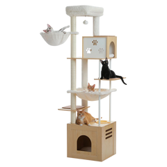 Cats on a tall wooden cat tree with hammocks, condos and a feeding bowl
