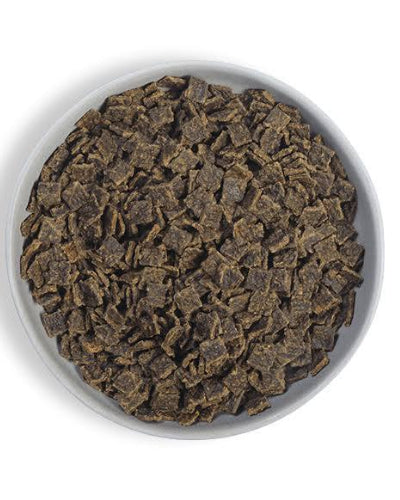 Bowl filled with air-dried pet food pieces