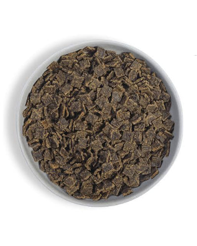 Bowl filled with air-dried pet food pieces